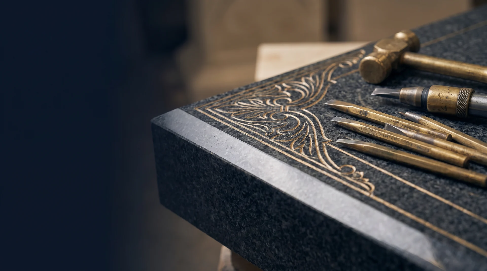Close detail of engraved granite and engraving tools